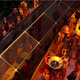 A render of people partying on the G Train with its folded down sides.